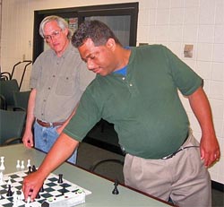 Ronnie Simpson showing Neal Harris (left) a position.