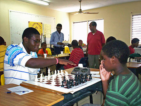 Elton Joseph (left) trots out the Parham Attack against an opponent. Photo by Bahamas Chess Federation.