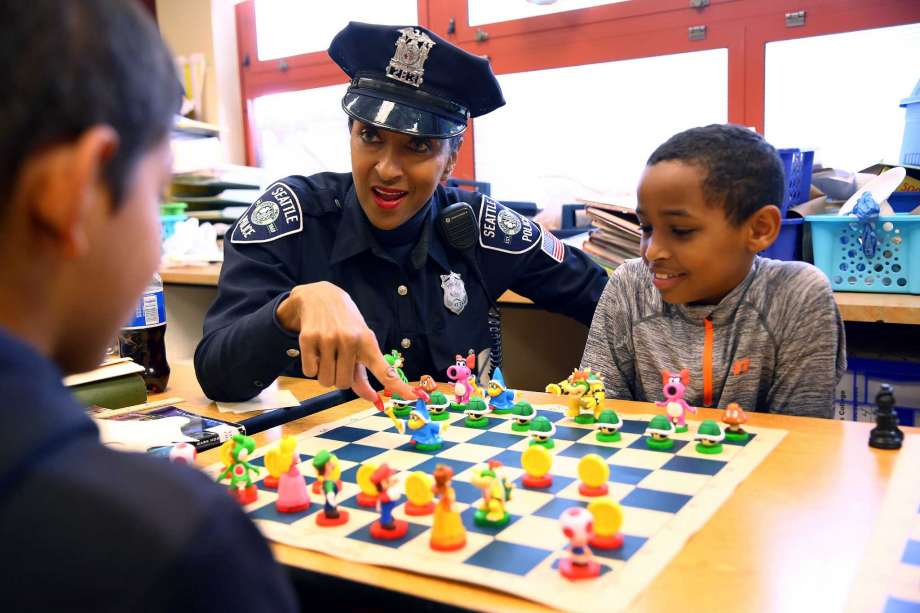 Officer Cookie has been teaching chess since 2006. Photo by Genna Martin.