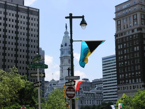 Bahamas flag flying with the City Hall in background. Photo by Daaim Shabazz.