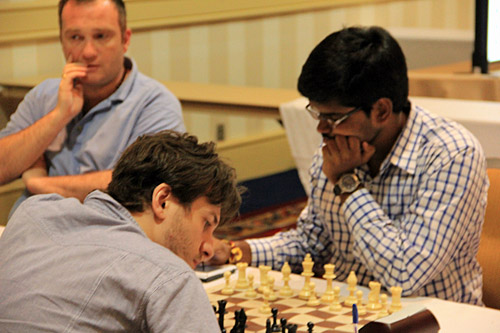 IM Shyam Nikhil (India) - GM Sergey Erenburg (Israel), 1/2. Photo by Daaim Shabazz.