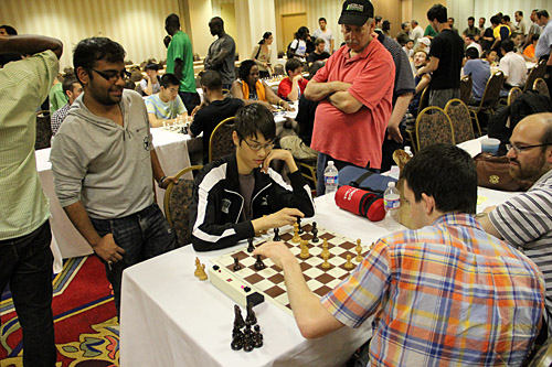 GM Ray Robson “Consultation Chess”… Teams of players get to discuss variations during the game. Photo by Daaim Shabazz.